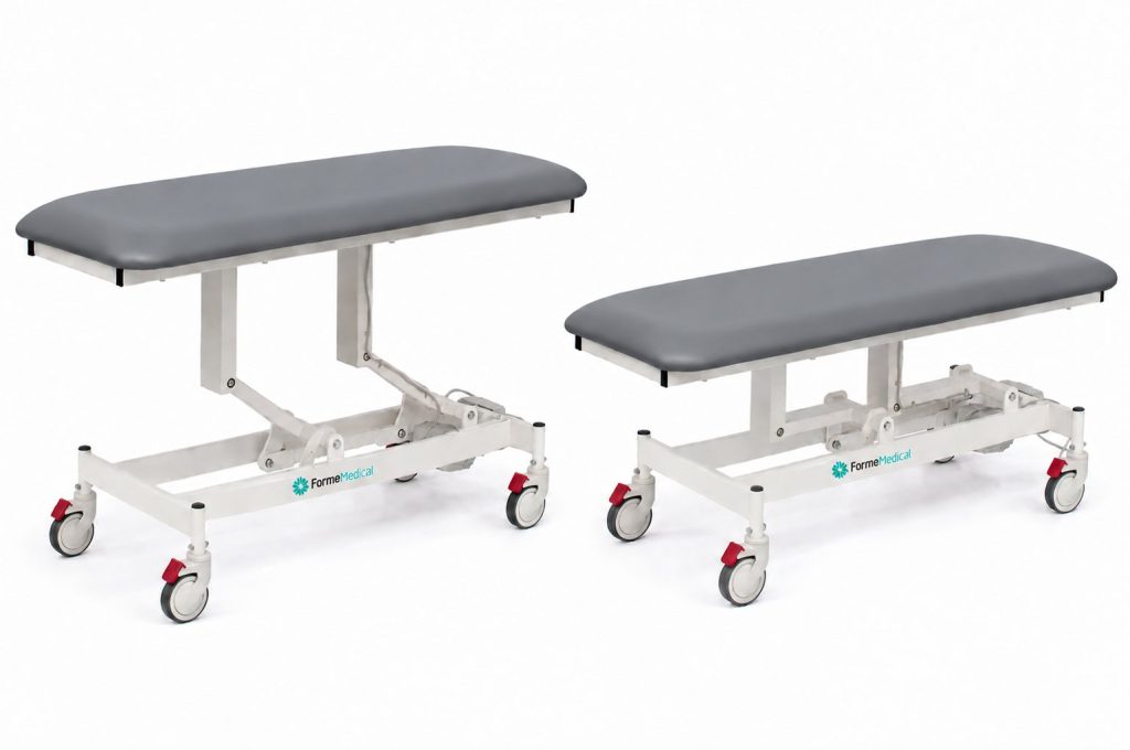 Forme Medical Jasper treatment table in grey, shown raised and lowered